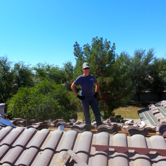 Roofing Contractor Standing on Roof